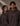 Two people wearing Coco brown hoodies with 'LUXE' branding against a neutral background