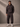 Man wearing Coco brown hoodies with 'LUXE' branding against a neutral background