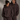 Two people wearing matching  Coco brown hoodies with a logo on a gray background