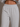 Gray sweatpants worn by a person on a neutral background